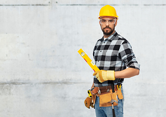 Image showing male worker or builder in helmet with level