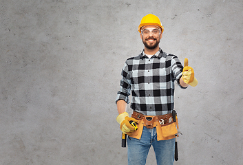 Image showing happy male worker or builder showing thumbs up