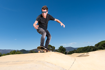 Image showing Skateboarder on a pump track park