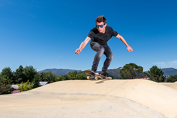 Image showing Skateboarder on a pump track park