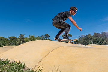 Image showing Skateboarder on a pump track park