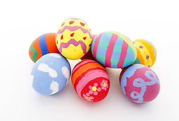 Image showing Children paint colorful easter egg