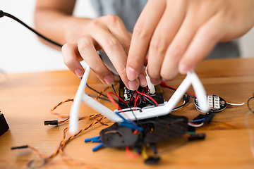 Image showing Connecting the wire of flying drone