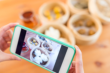 Image showing Taking photo on dim sum 