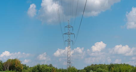 Image showing cloudy morning sky and a high-voltage line