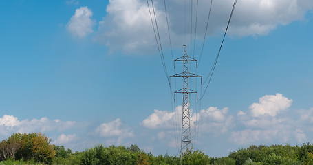 Image showing cloudy morning sky and a high-voltage line