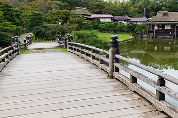 Image showing Japanese garden with wooden bridge