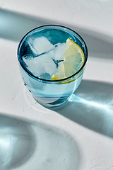 Image showing blue glass of water with lemon and ice