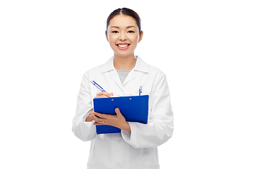 Image showing happy smiling asian female doctor with clipboard