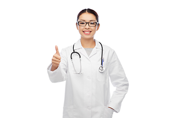 Image showing smiling asian female doctor showing thumbs up