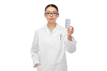 Image showing asian female doctor or nurse with medicine