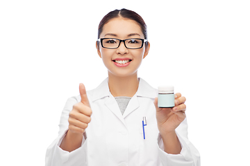 Image showing smiling asian female doctor or nurse with medicine