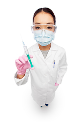 Image showing asian female doctor in mask with syringe