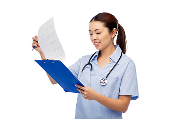 Image showing happy smiling asian female doctor with cardiogram