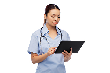 Image showing asian female nurse with tablet pc and stethoscope