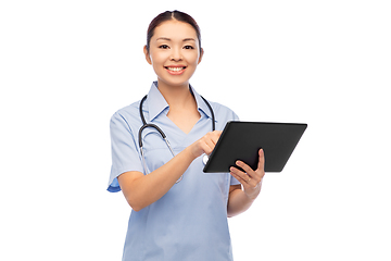 Image showing asian female nurse with tablet pc and stethoscope