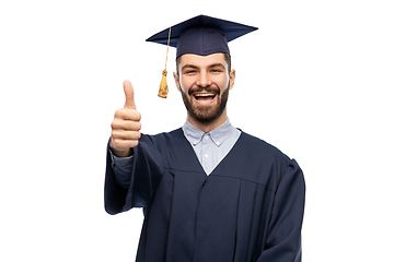 Image showing happy male graduate student showing thumbs up