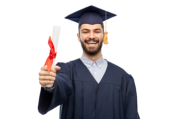 Image showing male graduate student in mortar board with diploma