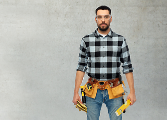 Image showing male worker or builder with tools and level