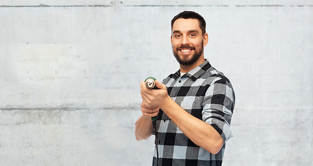 Image showing happy man, worker or builder with drill