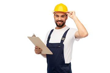 Image showing male worker or builder in helmet with clipboard