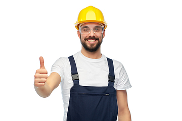 Image showing happy male worker or builder showing thumbs up