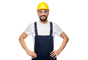 Image showing happy male worker or builder in helmet and overall