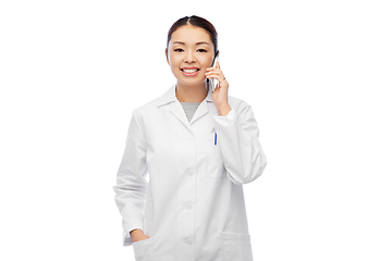 Image showing asian female doctor or nurse calling on smartphone