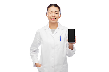 Image showing happy asian female doctor or nurse with smartphone