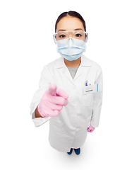 Image showing asian female doctor in mask, goggles and gloves