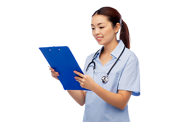 Image showing happy smiling asian female doctor with clipboard