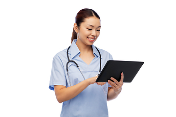 Image showing asian female nurse with tablet pc and stethoscope