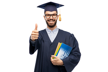 Image showing happy male graduate student showing thumbs up