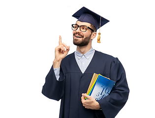 Image showing happy graduate student pointing his finger up