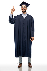 Image showing happy graduate student pointing his finger up