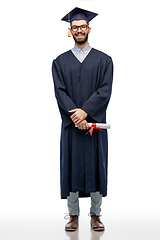 Image showing male graduate student in mortar board with diploma