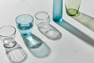 Image showing glassware dropping shadows on white surface