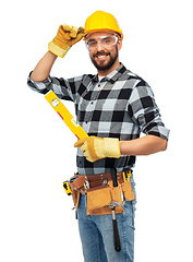 Image showing happy male worker or builder in helmet with level