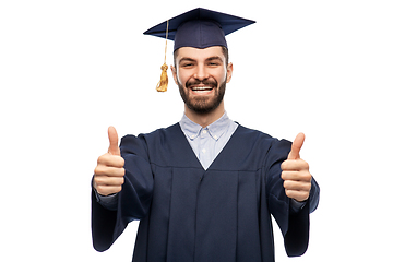 Image showing happy male graduate student showing thumbs up