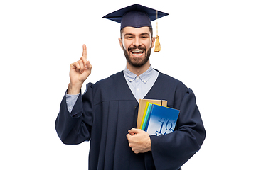 Image showing happy graduate student pointing his finger up