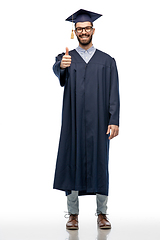 Image showing happy male graduate student showing thumbs up