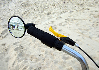 Image showing kids on the beach through the bike mirror