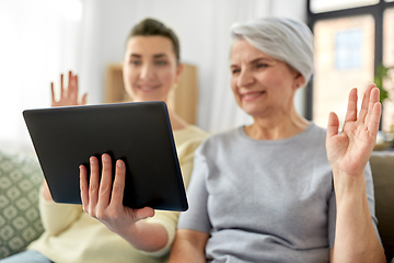 Image showing daughter and mother having video call on tablet pc