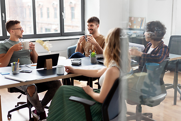 Image showing team of startuppers drinking coffee at office