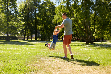 Image showing happy father with son playing in summer park