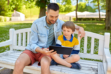 Image showing father and son with tablet pc computer at park