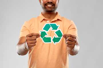 Image showing smiling indian man holding green recycling sign