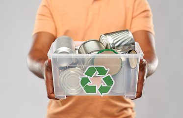 Image showing close up of young man sorting metallic waste