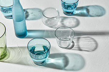 Image showing glassware dropping shadows on white surface