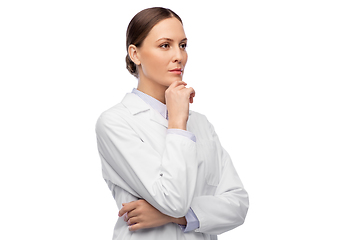 Image showing thinking female doctor in white coat